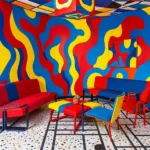 Memphis Milano design interior reimagined by AI with bold primary colors and geometric patterns